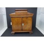 A Victorian walnut workbox, having two turned handles, mother of pearl escutcheon, hinged lid