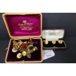 A boxed set of three 9ct gold buttons, marked 9ct, together with a collection of gold plated buttons