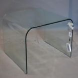 A curved glass coffee table