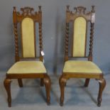 A pair of 19th century oak chairs with barley twist supports, raised on cabriole legs, H.103cm