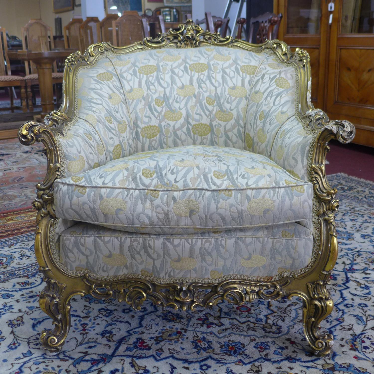 A pair of giltwood armchairs, with elaborate c-scroll and floral carved giltwood frames, on c-scroll - Image 5 of 7