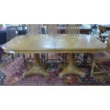 A fruitwood extendable dining table, with two pedestals on turned supports, H.75 x W.285 x D.115cm