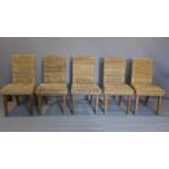 A set of five wicker chairs, on square legs
