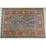 A small pure silk William Morris design Persian rug, signed, with all over stylised floral