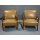 Two 1950's oak stud bound leather armchairs, H.75 W.64cm