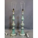 A pair of baluster turned and green lacquered wooden lamps, H.77cm