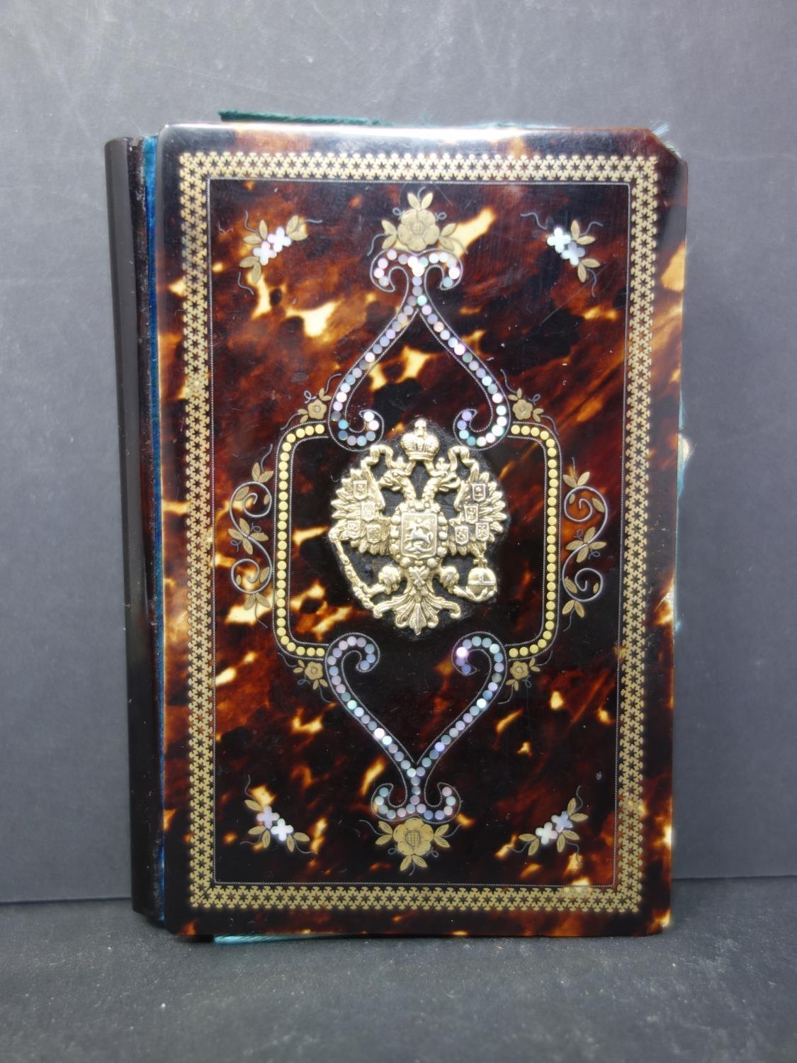 A 19th century Imperial Russian tortoiseshell and gilt inlaid note book, with central yellow metal