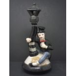 Vintage Bottle Garnier representing a drunk man holding on to a street lamp, H.32cm, dimensions of