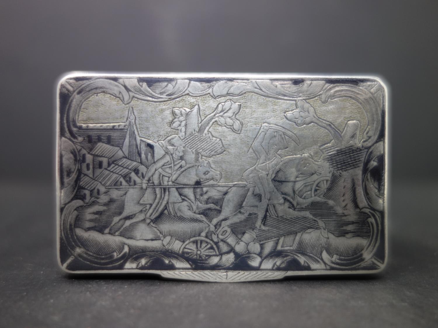 A rare 19th century Russian silver snuff box, with niello decoration, the top engraved with battle