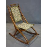 A 19th century oak campaign folding rocking chair