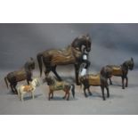 A collection of six Middle Eastern wooden horses to include four copper clad horses and two
