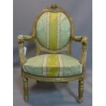 A 19th century French Louis XVI style fauteuil armchair, with striped floral upholstery, carved