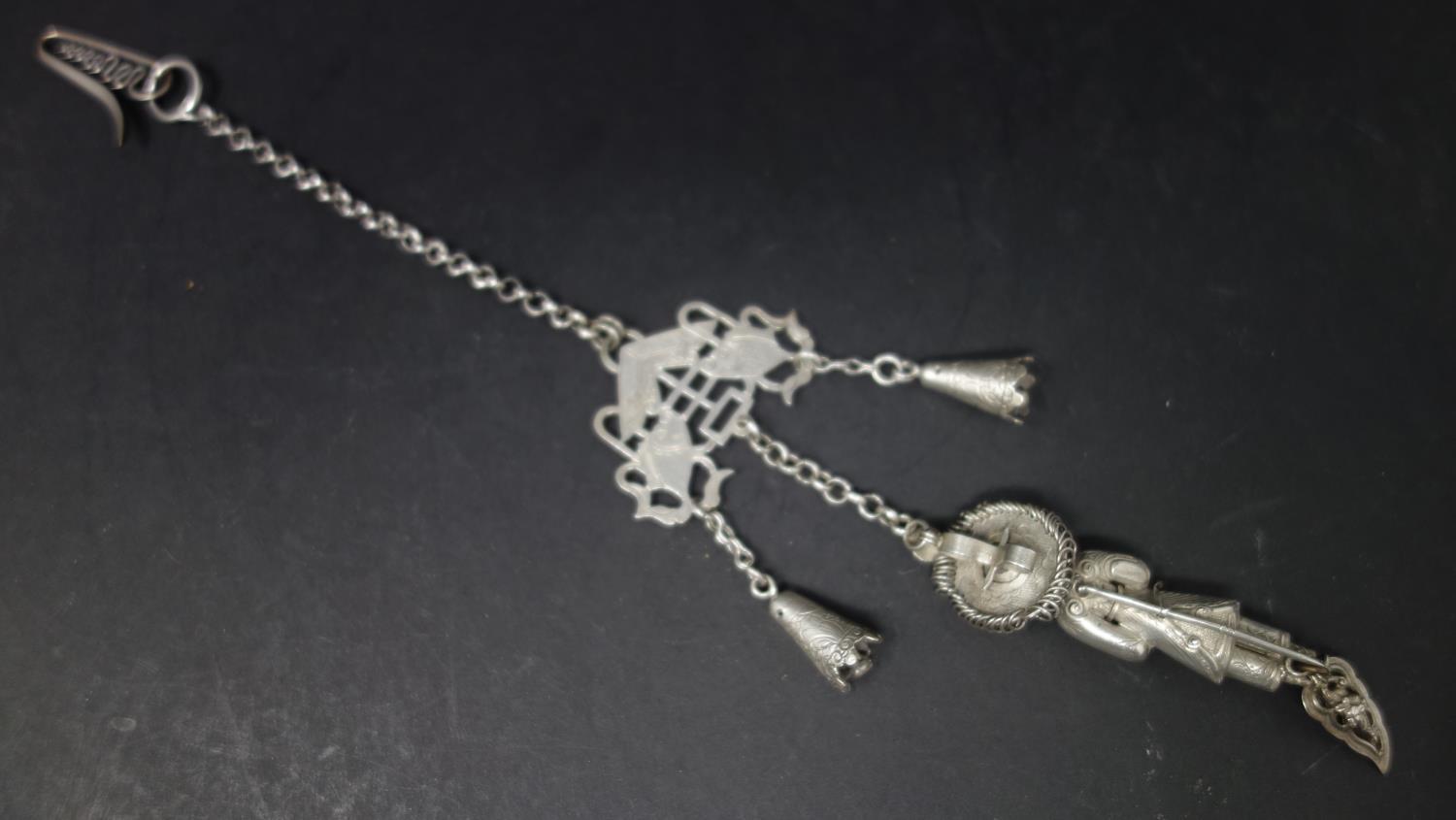 A late 19th century Chinese white metal chatelaine, with bells, pierced fish plaque and figure of - Image 3 of 3