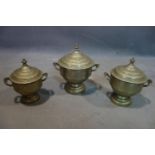 Three early 20th century middle eastern pewter tea caddys, stamped to base, largest H.27cm