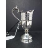 A silver jug commemorating the 350th Anniversary of The Sailing of the Mayflower and the founding of