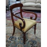 A 19th century mahogany scroll arm desk chair