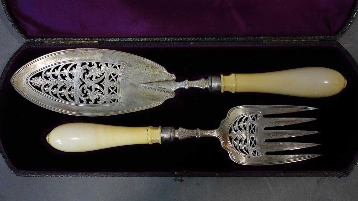 A pair of Victorian silver and ivory fish servers made by Walter & John Barnard in London