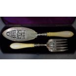 A pair of Victorian silver and ivory fish servers made by Walter & John Barnard in London
