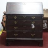 An early 19th century oak bureau, H.110 W.95 D.52cm