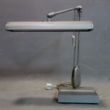 A vintage adjustable desk lamp