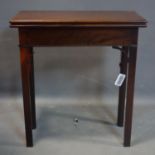 A 19th century mahogany fold over tea table, H.71 W.67 D.67cm (extended)