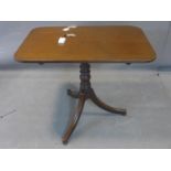 A 19th century mahogany rectangular occasional table, on turned supports and three outswept feet,