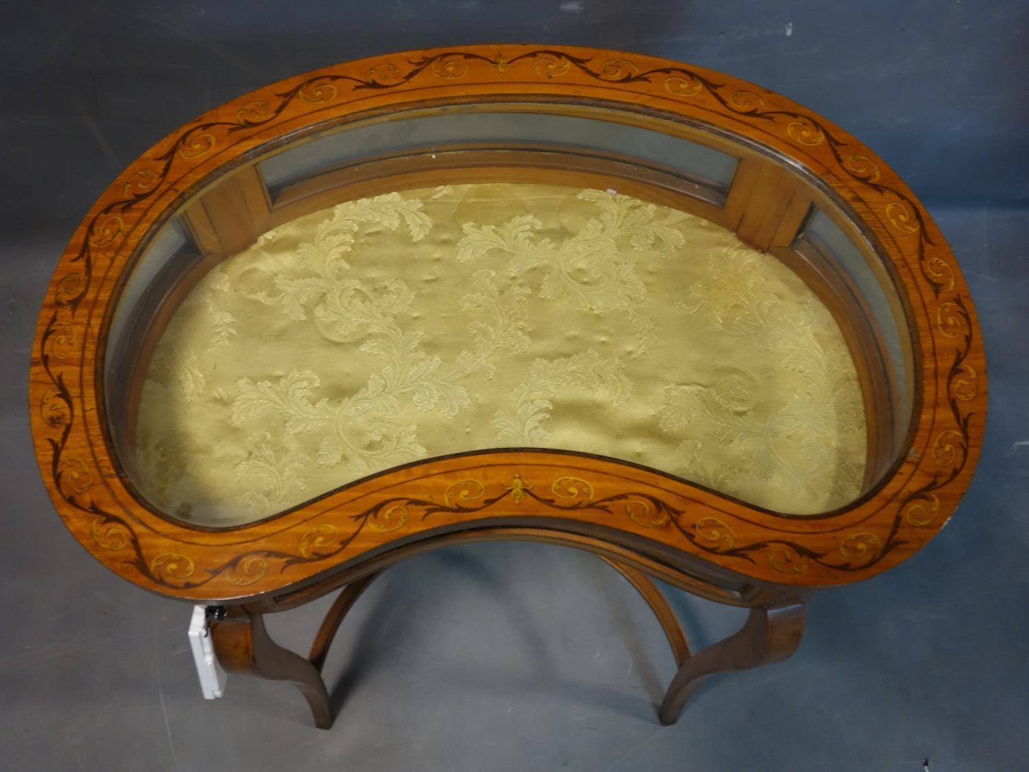 A 19th century inlaid satin wood kidney shaped bijouterie cabinet, raised on splayed legs joined - Image 3 of 4