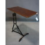 An early 20th century adjustable reading table with makers stamp for John Watts, H.71 W.67 D.36cm