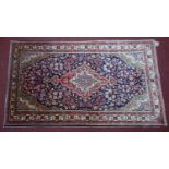 A North West Persian Sarouk rug, the double pendant medallion with repeating petal motifs, on a