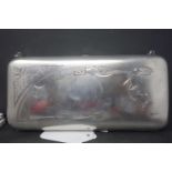 An early 20th century Russian silver clutch purse, engraved with monogram and floral decoration,