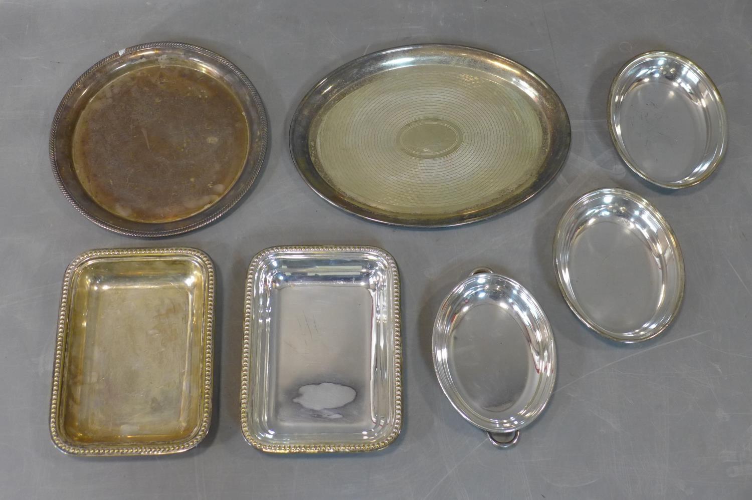 A collection of seven silver plated trays, mostly 19th century