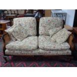 An early 20th century Queen Anne style burr walnut bergere sofa