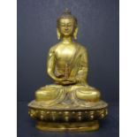 A brass figure of Buddha, seated on a lotus base, H.20cm