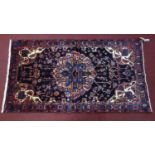 A North West Persian Nahavand Rug, the central double pendant medallion with repeating petal motifs,