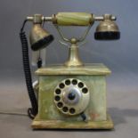A vintage onyx and brass phone