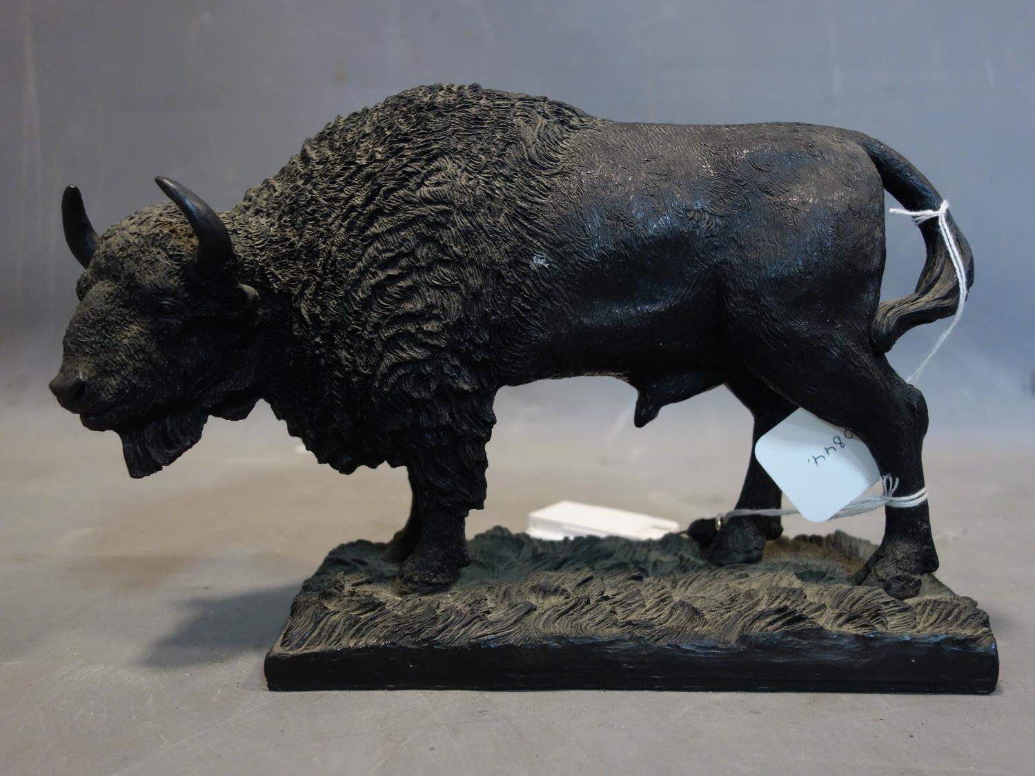 A resin sculpture of a bison by Minerva fine arts, H.21 W.30 D.12cm