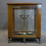 A set of vintage weighing scales with slate base, in glass case, H.54 W.43 D.28cm