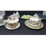 A group of ceramic items including three teacups, two trays and one candlestick