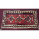 A south west Persian Qashqai kilim, the triple pole medallion with repeating geometric motifs, on