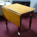 A 20th century pine drop leaf dining table with painted base, H.73 W.93 D.82cm