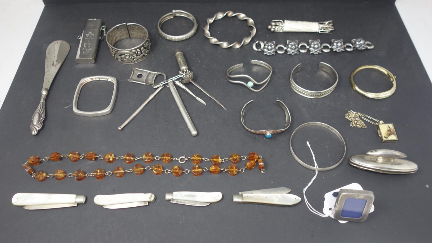 A mixed collection of silver and silver plated items, to include silver bangles, containers,