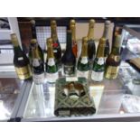A collection of 12 bottles of champagne, 3 boxed, together with 3 bottles of brandy