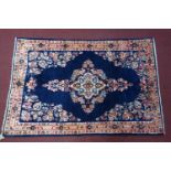 A north west Persian Mahal rug, the central floral medallion, on a sapphire ground, contained by