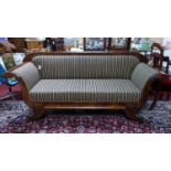 A Regency mahogany sofa raised on scroll feet, H.94 W.214 D.67cm