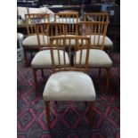 A set of six 20th century teak dining chairs