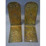 A pair of Arts and Crafts brass brackets, repousse embossed with floral motifs, H.44 W.19 D.34cm