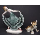 A German porcelain figure of a lady, H.26.5, together with a Soviet porcelain tiger, marked 'Made in