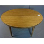 A 20th century teak dining table with butterfly leaf, H.75 W.143 D.138cm