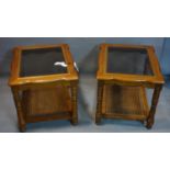 Two solid wood coffee tables, with bevelled glass tops, with rattan undertier, on turned supports,