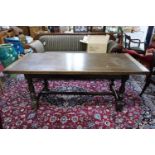 A 20th century oak refectory dining table, raised on turned legs, joined by stretcher, H.75 W.180